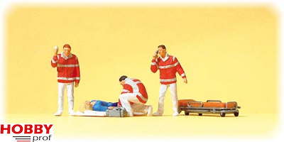Paramedic team, injured persons on blanket